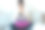 一个年轻漂亮的女人坐在家里的沙发上一边用笔记本电脑工作一边用智能手机发信息。图片下载
