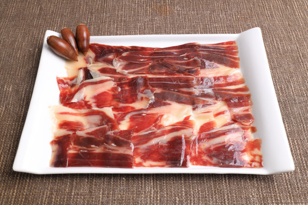 部分100%橡子喂养的伊比利亚火腿Dehesa de Extremadura装饰橡子图片下载