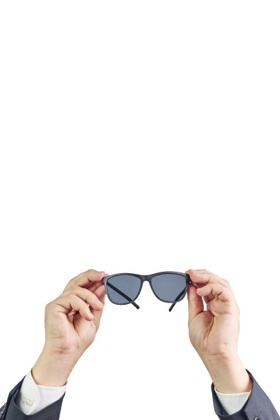 一个戴着太阳镜的商人的手视图。图片下载