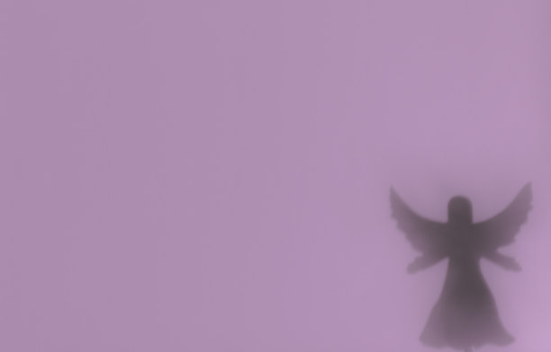 背景与天使的轮廓在柔和的颜色图片下载