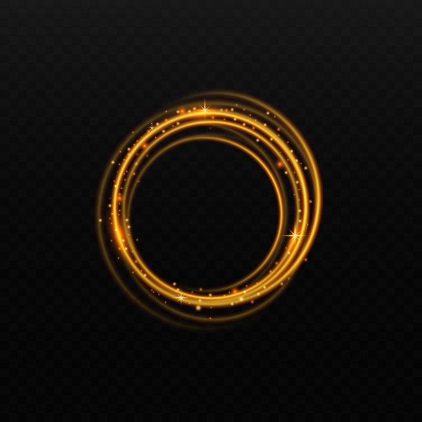 金色光圈与发光孤立在黑色背景，金光闪闪的金戒指图片下载