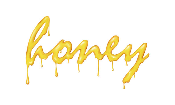 用天然蜂蜜绘制的蜂蜜字。甜美的字母在白色的背景上流淌。图片下载