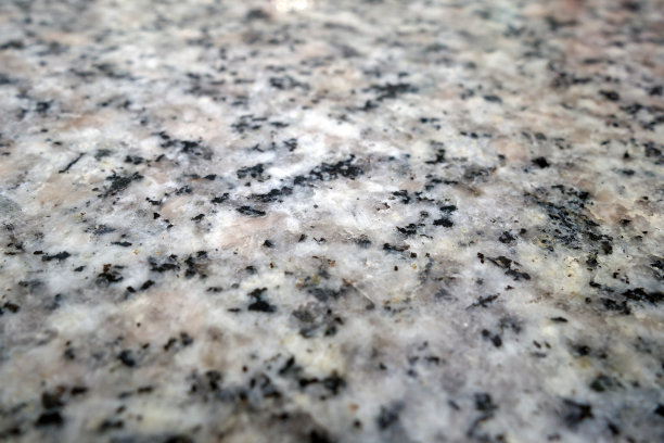 花岗岩表面作为背景，具有模糊效果。图片下载