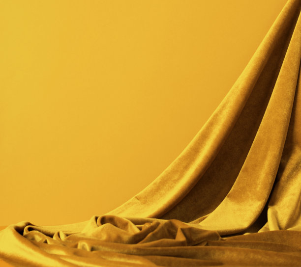 抽象裙楼背景与时髦的金黄天鹅绒织物图片下载