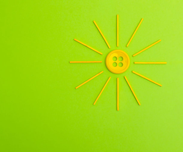 程式化的太阳在一个绿色的背景图片下载