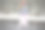 在水泥墙的映衬下，身穿粉色长裙的少女正在冰上滑冰。图片下载