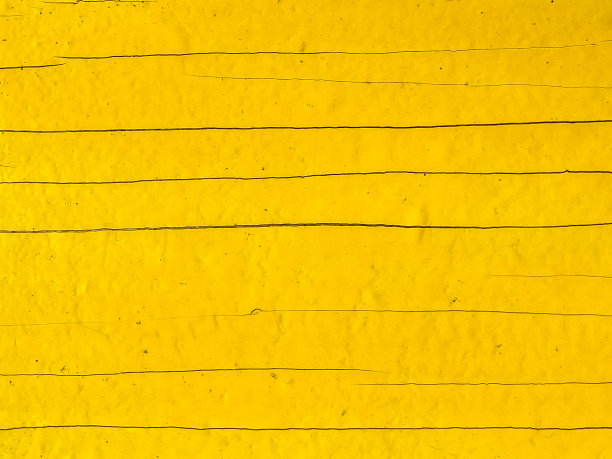 黄色木制背景。旧的黄色木板。黄色油漆木材的纹理，用于广告和照片图片下载