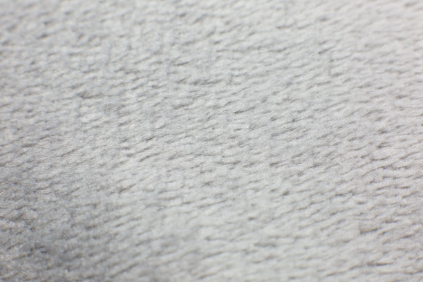 灰色棉布毛巾或地毯蓬松的纹理背景。特写，微距照片。软焦点的形象。图片下载