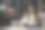 年轻的印度女人坐在沙发上看电视，笑着享受:-库存照片图片下载