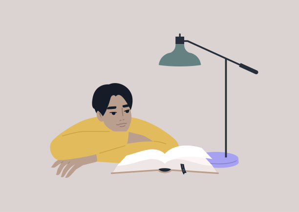 一个年轻的亚洲男性人物倚着胳膊读一本书，教育过程，一个大学生准备考试图片下载