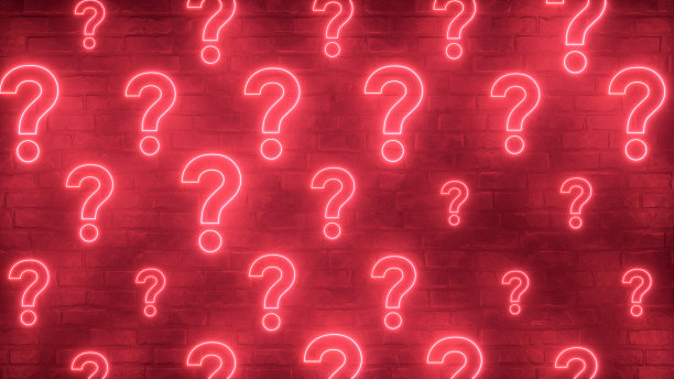砖墙上的问号霓虹灯图片下载