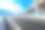 蓝天下柏油路山。图片下载