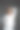 画室里一个灰色背景的漂亮女人穿着白裤子和白衬衫图片下载