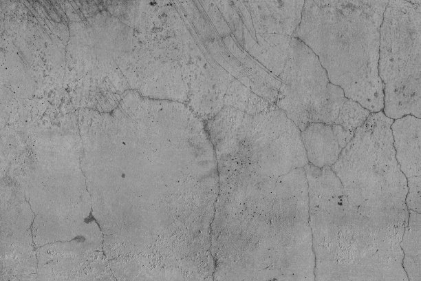 地板墙面纹理混凝土开裂。沥青路面旧水泥石开裂。由时间和天气条件造成的自然破坏。非彩色，黑白照片。图片下载