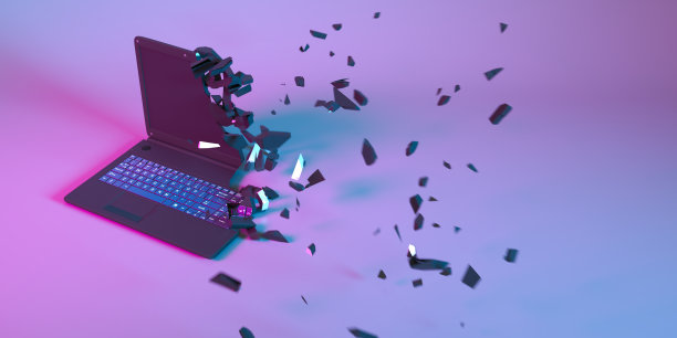 霓虹灯下的笔记本电脑分解成小部件图片下载