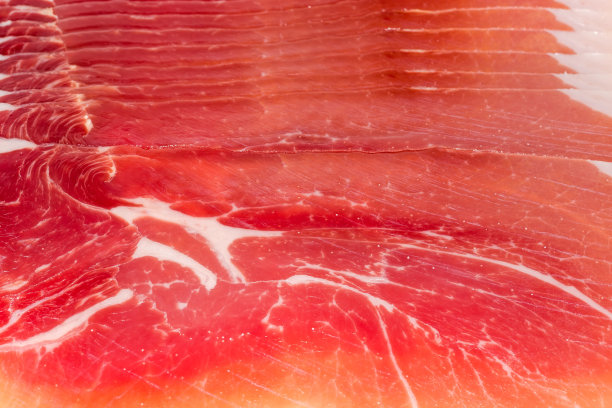 薄片的火腿特写，背景，质感图片下载