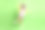 无忧无虑迷人的女孩喜欢跳舞的照片穿黄色的夹克，紫色的衣服，粉红色的帽子，鞋子孤立的绿色背景图片下载