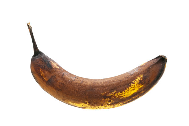 过熟有斑点的香蕉，黄色腐烂的皮，素食孤立的外来水果在白色的背景。图片下载