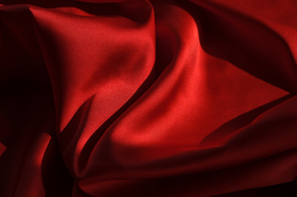 红色丝绸的背景。红色的背景布。材料红色纹理图片下载