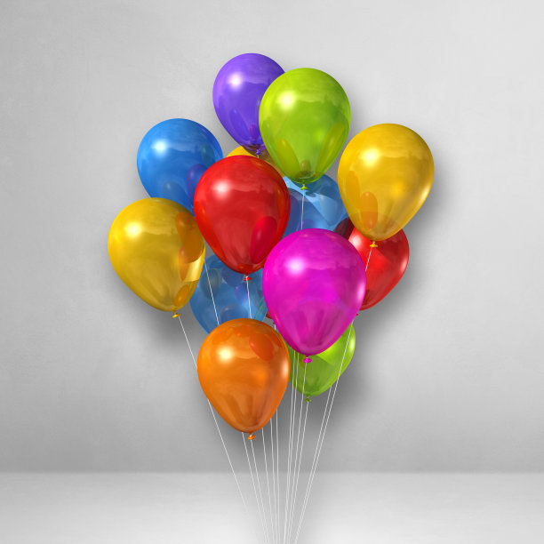 彩色的气球串在白色的墙壁背景上图片下载