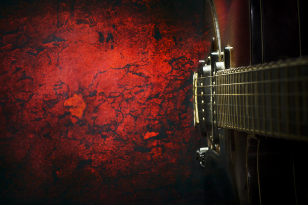 老，爵士电吉他上的红色垃圾摇滚背景。副本的空间。俯视图音乐节、音乐会背景。音乐教育。音乐会的概念。图片下载