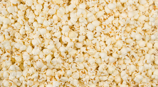 撒盐爆米花背景微距拍摄图片下载