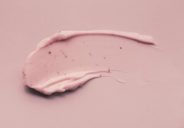 光滑的粉红色米褐色粘土面膜样品纹理粉底隔离在多色的背景图片下载