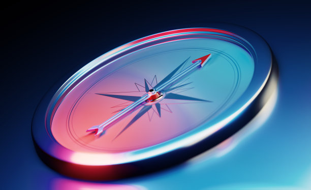 指南针坐在金属的深蓝色背景图片下载