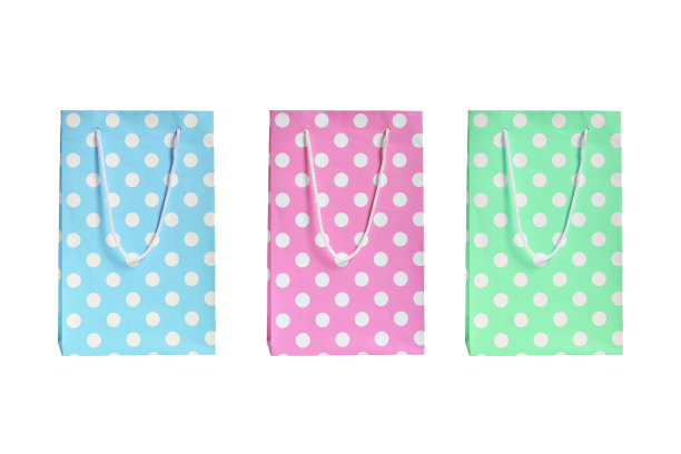 礼品袋与处理蓝粉色和绿色在白色的背景图片下载