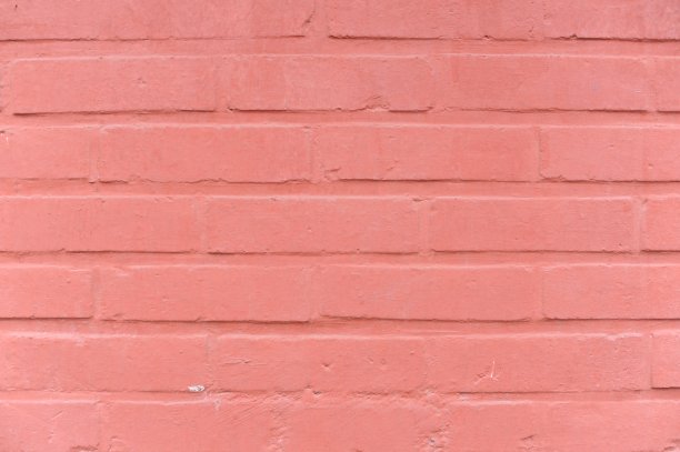 一堵有着粗糙花纹表面的古砖石墙体，有着复杂的背景纹理和设计图片下载