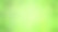 绿色模糊背景的LED灯泡与散景。假日照明霓虹灯闪亮散焦背景。图片下载