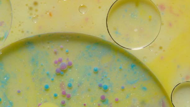 明亮的霓虹灯彩色气泡油和墨水，丙烯酸漆移动特写，壁纸背景图片下载