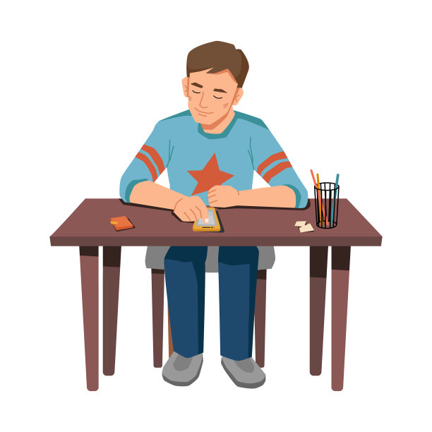 一个拿着智能手机的小男孩独自坐在桌子旁图片下载