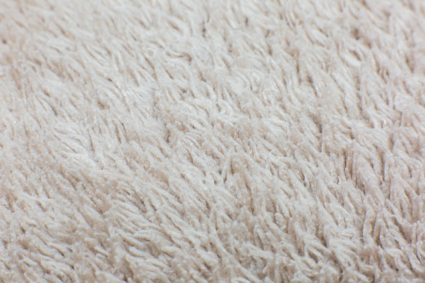 米色棉布毛巾或地毯蓬松的纹理背景。特写，微距照片。软焦点的形象。图片下载