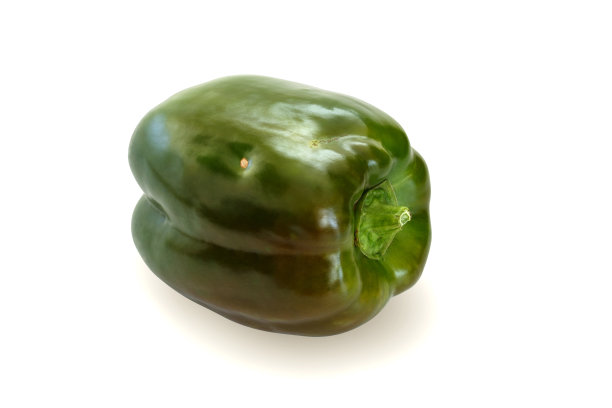 非理想的带有斑点的绿色钟纸，平铺在平面上，孤立在白色背景上。一个剪切路径包括..图片下载