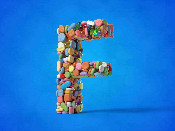 不同的药丸堆叠在字母f的形状，蓝色背景的3D插图。图片下载