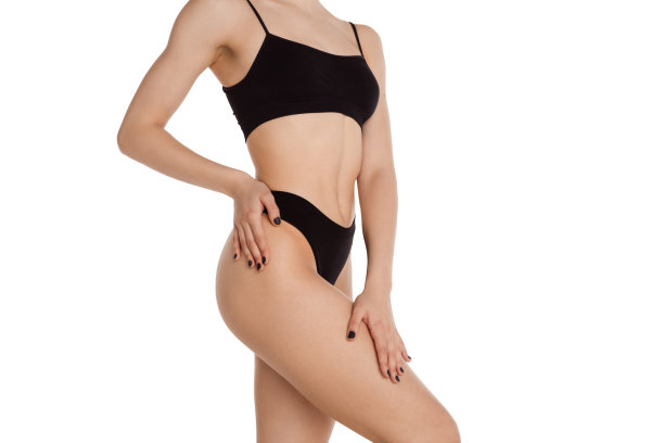 美丽的女性身体在黑色内衣在白色的背景。图片下载