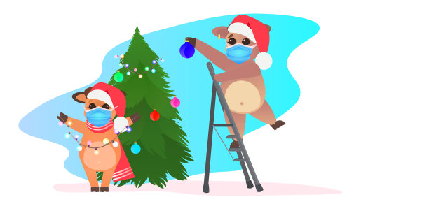 牛戴着圣诞帽装饰圣诞树图片下载
