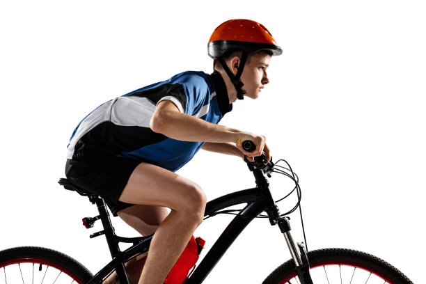 年轻的白人男孩骑自行车在公路自行车孤立在白色的背景。图片下载