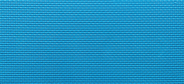 健身橡胶垫质地。蓝色软泡沫瑜伽垫的肋面。体育活动和健身锻炼的概念背景。健康生活方式设计元素。微距镜头。图片下载