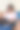 年轻女性坐在家里的沙发上用笔记本电脑工作图片下载