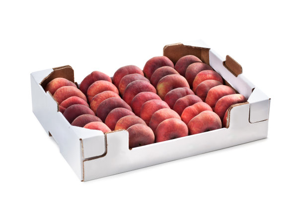 扁桃白纸盒-甜圈桃或Saturn桃，扁桃排列，在水果市场的纸盒订购图片下载