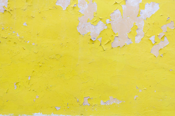 石墙和旧的黄色油漆。明亮的垃圾摇滚明亮的纹理图片下载
