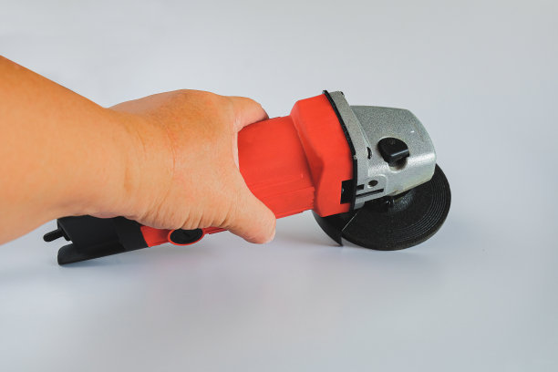 强大的角磨床与磨盘背景。图片下载