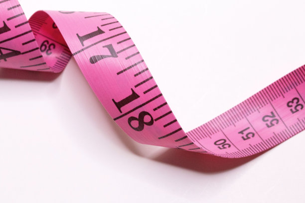 粉色卷尺测量英寸和厘米图片下载