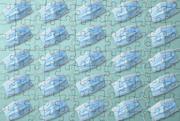 用拼图制作的一排防护面罩。图片下载