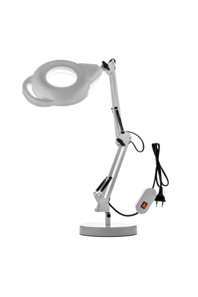 带有放大镜的台灯。在白色背景上有照明的放大镜。图片下载