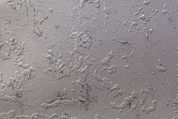 凹凸不平的金属表面旧灰漆剥落的纹理。设计元素图片下载