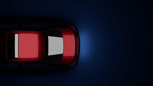 红色的车在黑暗中，在蓝色的背景上图片下载