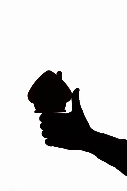 男手上竖着大拇指的房子剪影，概念房屋建筑代理广告图片下载